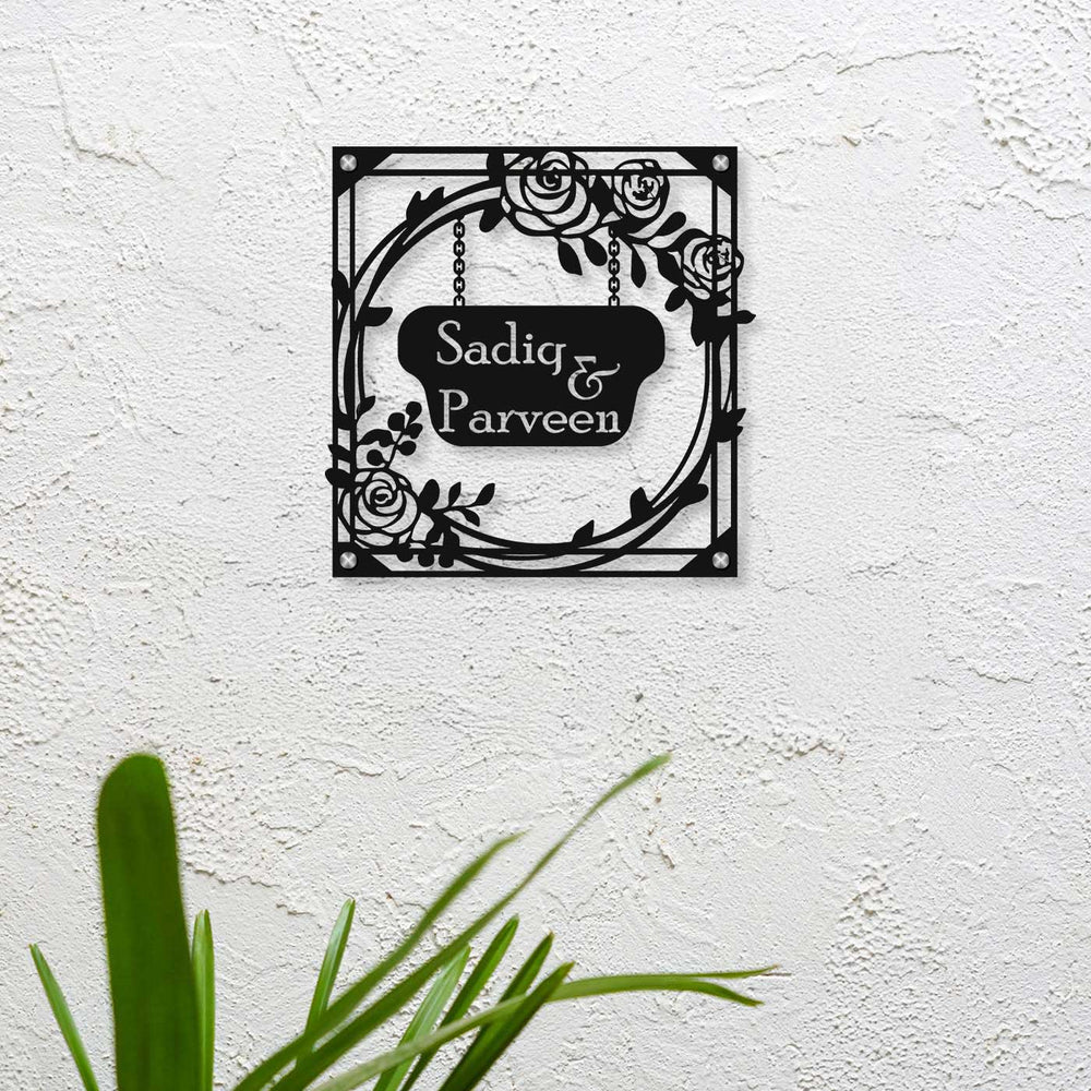 Personalized Laser Cut Rose Theme Steel Name Plate - Mounted on Textured Wall
