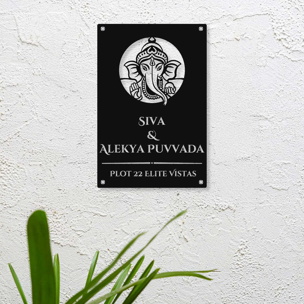 Personalized Laser Cut Ganesha Theme Steel Vertical Name Plate - Mounted on Textured Wall Close-up
