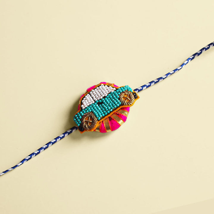Handmade Reusable Pink Car Felt Kids Rakhi - Front View on Plain Background