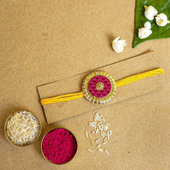 Handmade Maroon And Yellow Round Fabric And Mdf Rakhi With Roli Chawal - Rakhi with Traditional Items
