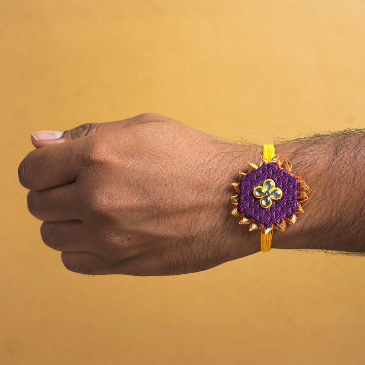 Handmade Purple Hexagon Fabric And Mdf Rakhi With Roli Chawal - Rakhi worn on wrist