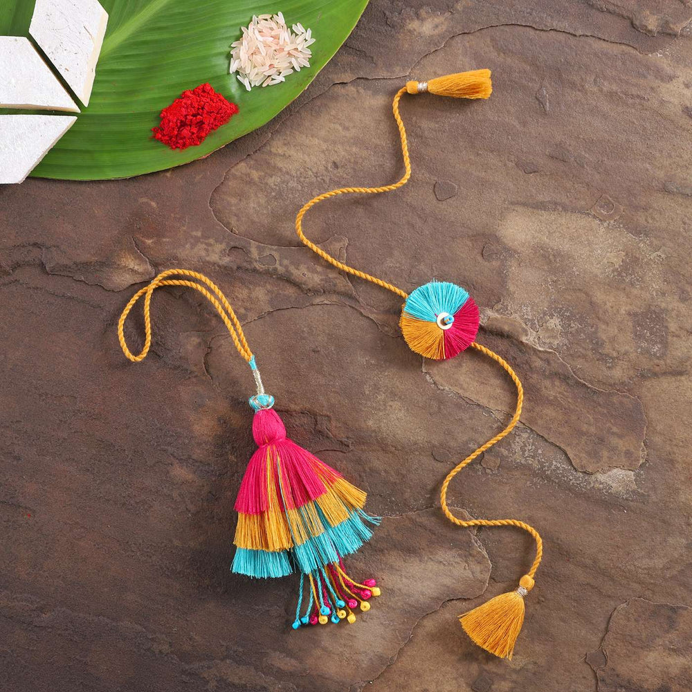 Handmade Beaded Rangrez Cotton Bhaiya Bhabhi Rakhi With Roli Chawal Set Of 2 - Full view on textured surface