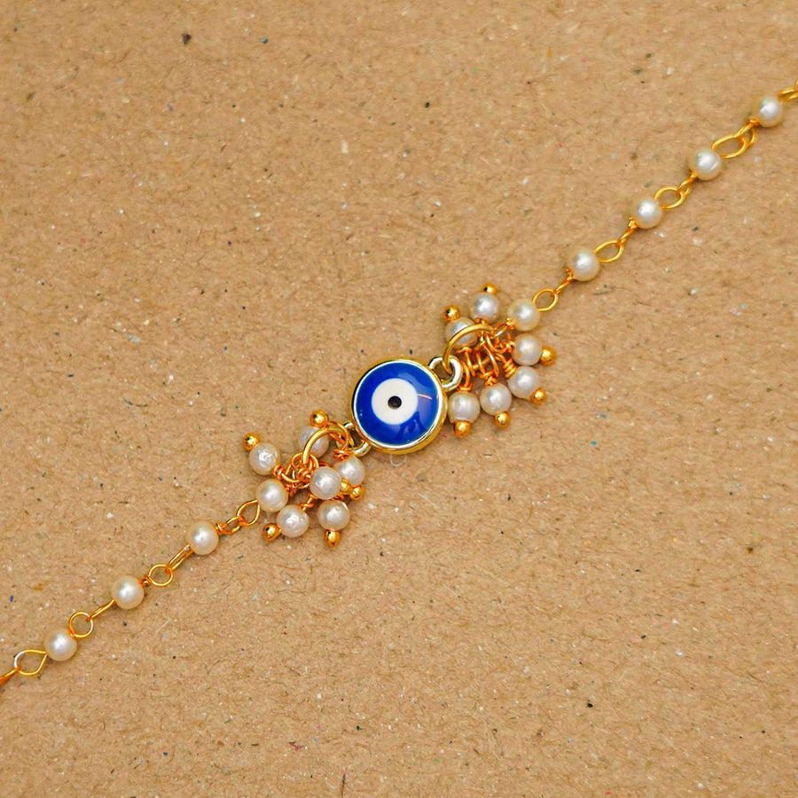Reusable Resin Evil Eye Bracelet Rakhi With Roli Chawal For Sisters - Close-up of single bracelet