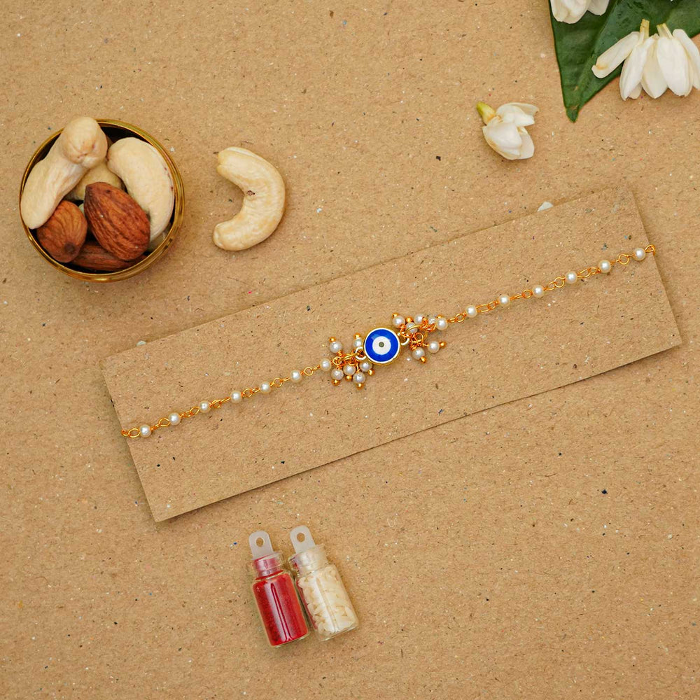 Reusable Resin Evil Eye Bracelet Rakhi With Roli Chawal For Sisters - Bracelet on gift packaging