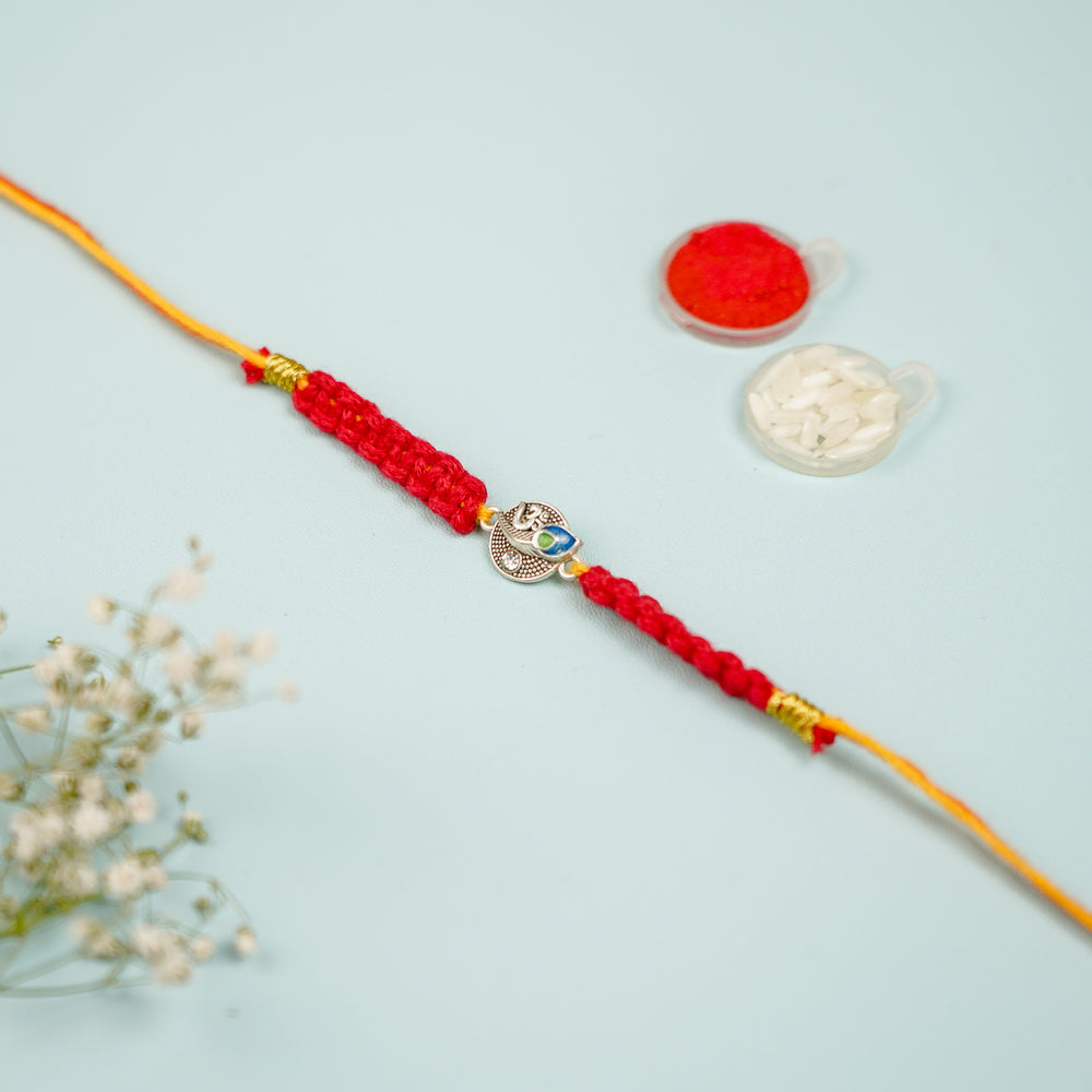 Handmade Macrame Religious Om Theme Metal Rakhi With Roli Chawal - Full View with Decorative Items