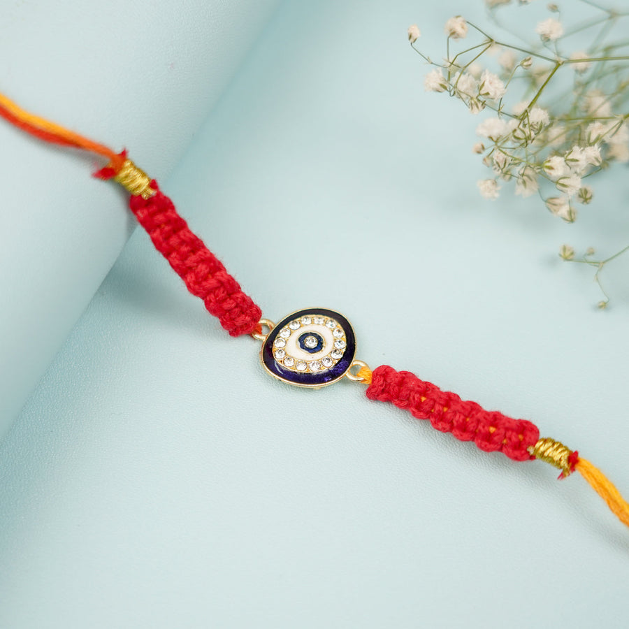 Customized Handmade Macrame Evil Eye Metal Rakhi With Roli Chawal - Close-up of central charm