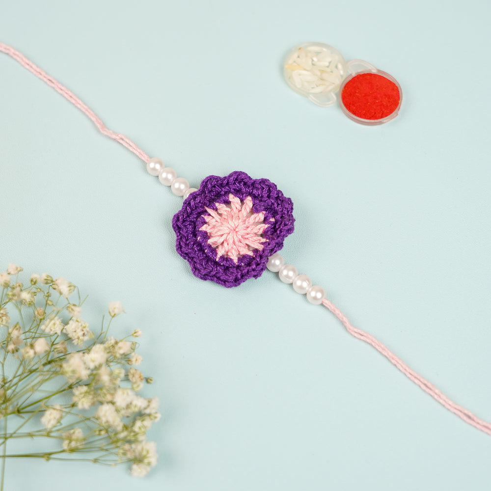 Handmade Crochet Purple Floral And Beads Rakhi With Roli Chawal For Bhaiya Bhabhi And Kids - Close-up of Crochet Flower