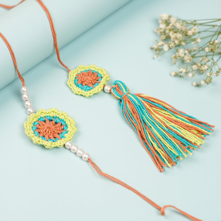 Handmade Crochet Multicolor Floral And Beads Rakhi With Roli Chawal For Bhaiya Bhabhi And Kids - Full View with Tassel