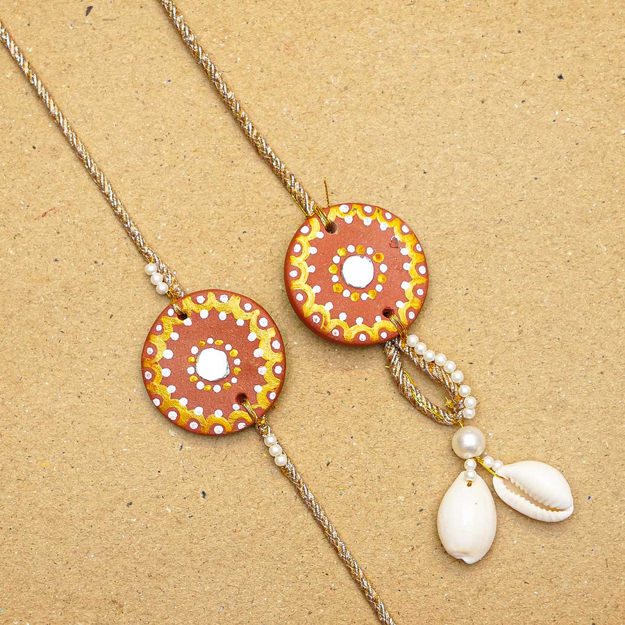 Terracotta Mandala Design Rakhi With Roli Chawal - Pair Close-up