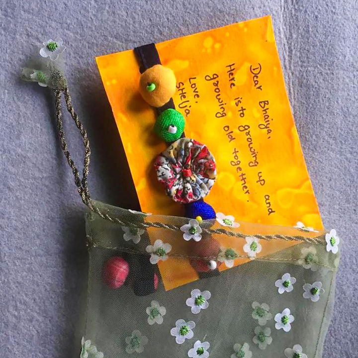 Handmade Beaded Shell Design Upcycled Fabric Rakhi With Roli Chawal For Brother - Packaged with note and pouch