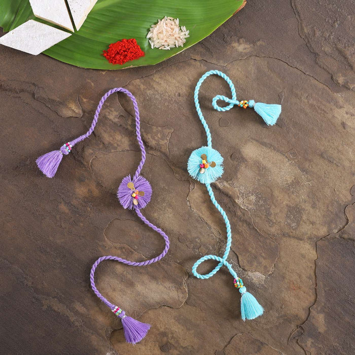 Handmade Threads Cotton Rakhi With Roli Chawal Set Of 2 - Top View with Festival Elements