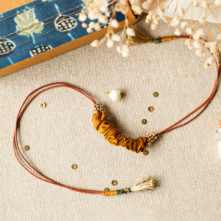 Handmade Reusable Gold Beads And Gathered Upcycled Fabric Rakhi With Roli Chawal For Brother - Front View