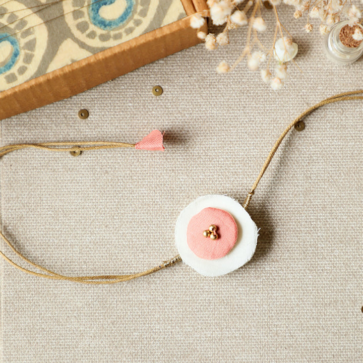 Handmade Reusable Round Layered Petal Beads Upcycled Fabric Rakhi With Roli Chawal For Brother - Front View with Pink Detail
