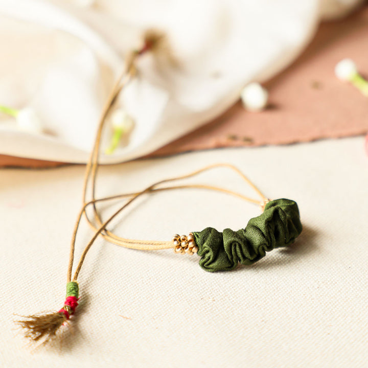 Handmade Reusable Gold Beads And Gathered Upcycled Fabric Rakhi With Roli Chawal For Brother - Front View (5)