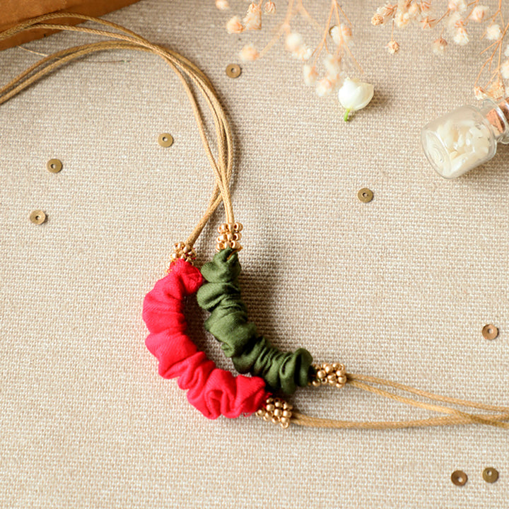 Handmade Reusable Gold Beads And Gathered Upcycled Fabric Rakhi With Roli Chawal For Brother Set Of 2 - Necklaces with different color pairs