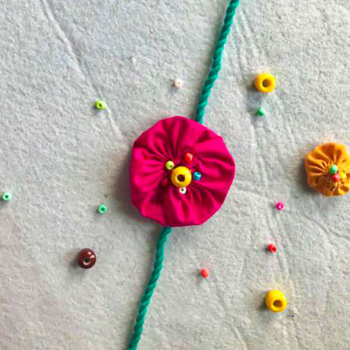 Handmade Beaded Yo Yo Flower Design Upcycled Fabric Rakhi With Roli Chawal For Brother - Close-up of fabric flower detail