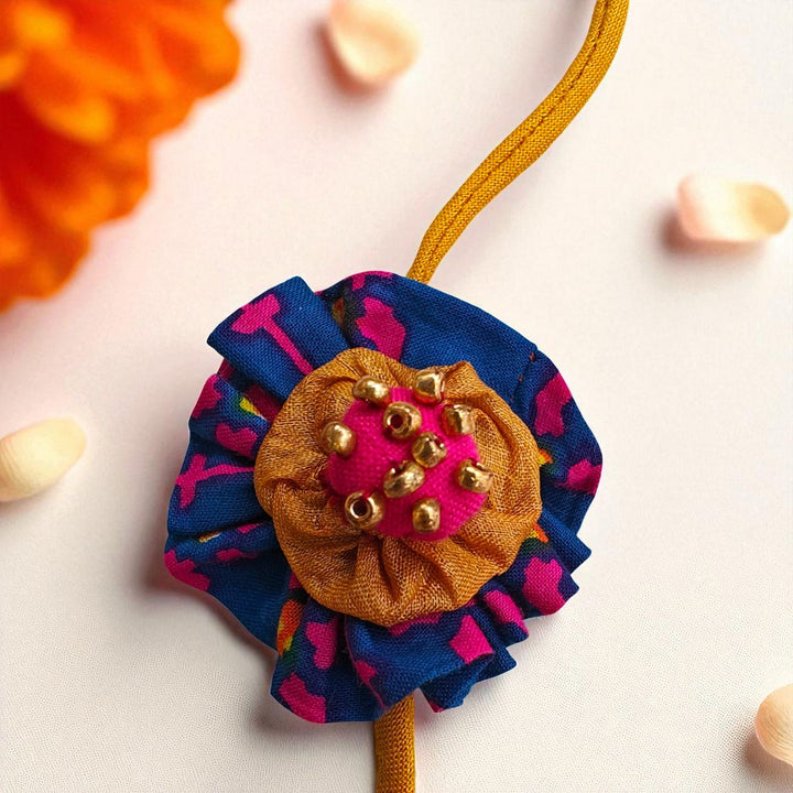 Handmade Beaded Flower Design Upcycled Fabric Rakhi With Roli Chawal For Brother 1 - Close-up of Embellished Flower