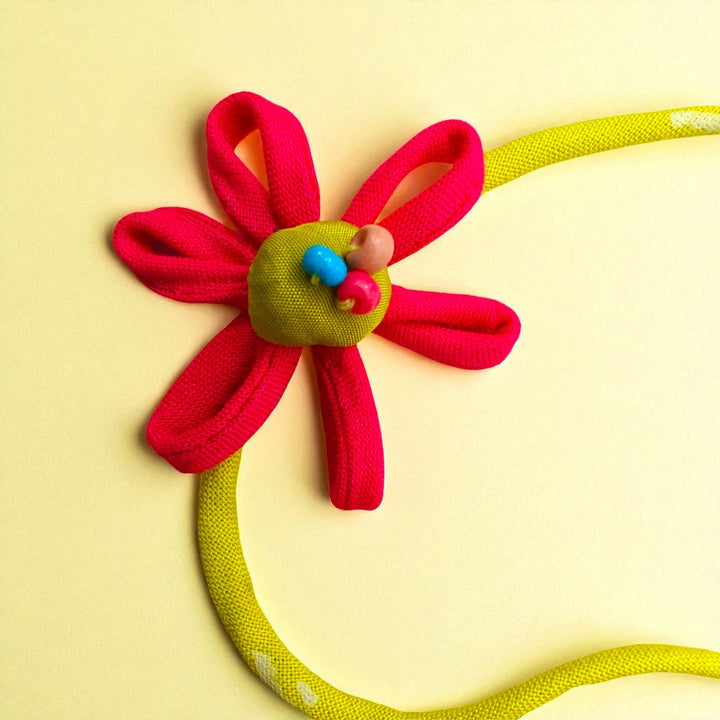 Handmade Flower Design Upcycled Fabric Rakhi With Roli Chawal For Brother - Close-up of Single Necklace Flower