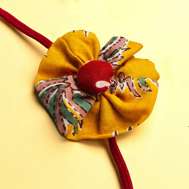 Handmade Flower Design Upcycled Fabric Rakhi With Roli Chawal For Brother - Close-up of Fabric Flower Texture