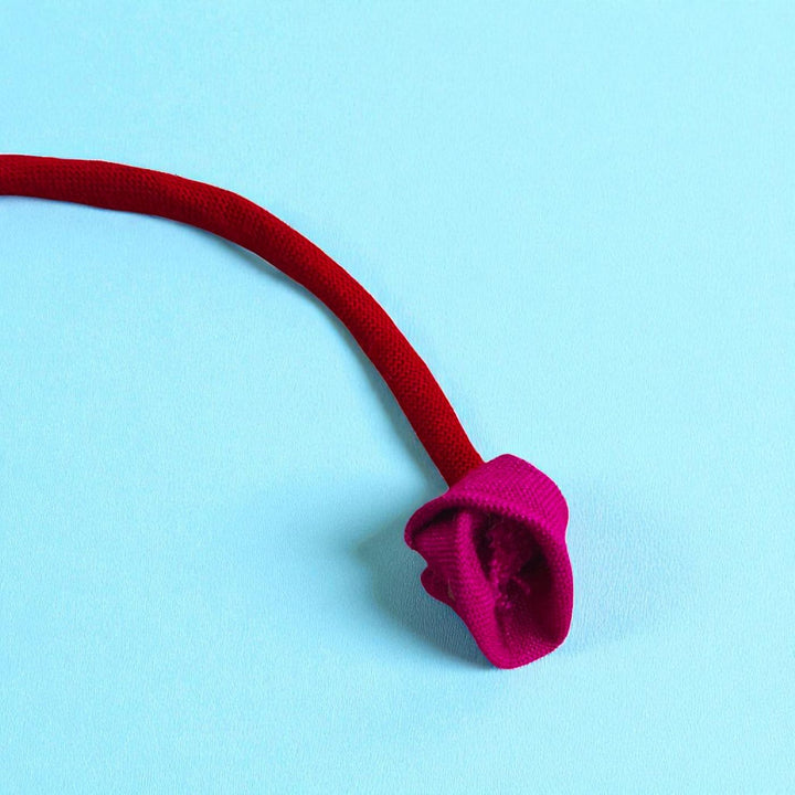 Handmade Yellow Flower Pom Pom Design Upcycled Fabric Rakhi With Roli Chawal For Brother - Close-up of Fabric Flower Tip