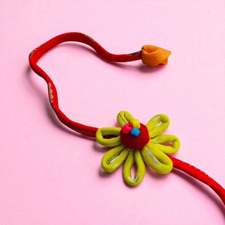 Handmade Loop Petal Flower Design Upcycled Fabric Rakhi With Roli Chawal For Brother - Full Length with Flower and End