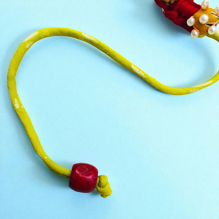 Handmade Golden Coiled Pearl Upcycled Fabric Rakhi With Roli Chawal For Brother - Closure End Detail