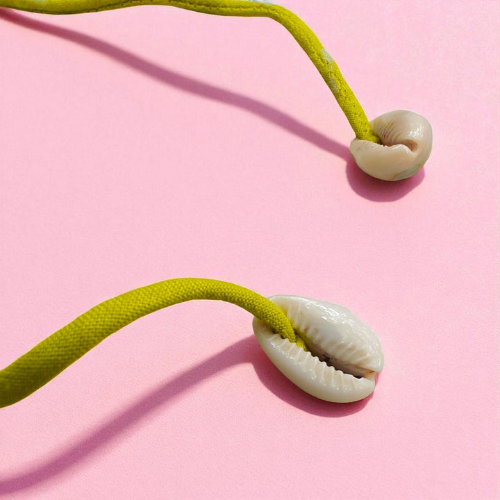 Handmade Beaded Pink Petal Flower Design Upcycled Fabric Rakhi With Roli Chawal For Brother - Close-up of Shell Ends