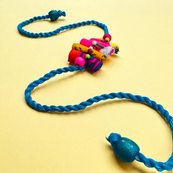 Handmade Beaded Roll Stacked Design Upcycled Fabric Rakhi With Roli Chawal For Brother - Back View Showing Clasp