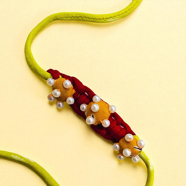 Handmade Beaded Flower Design Upcycled Fabric Rakhi With Roli Chawal For Brother 1 - Close-up of Beaded Section