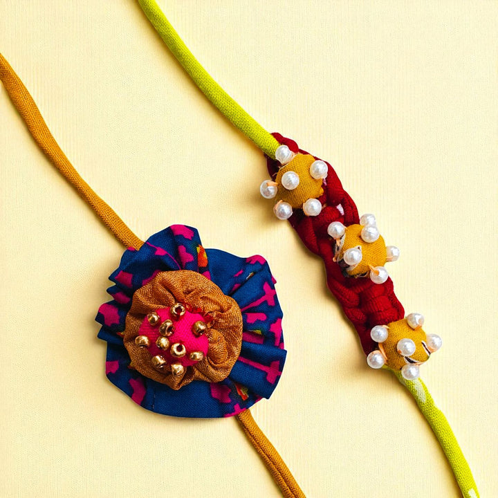Handmade Beaded Flower Design Upcycled Fabric Rakhi With Roli Chawal For Brother 1 - Front View of Two Necklaces