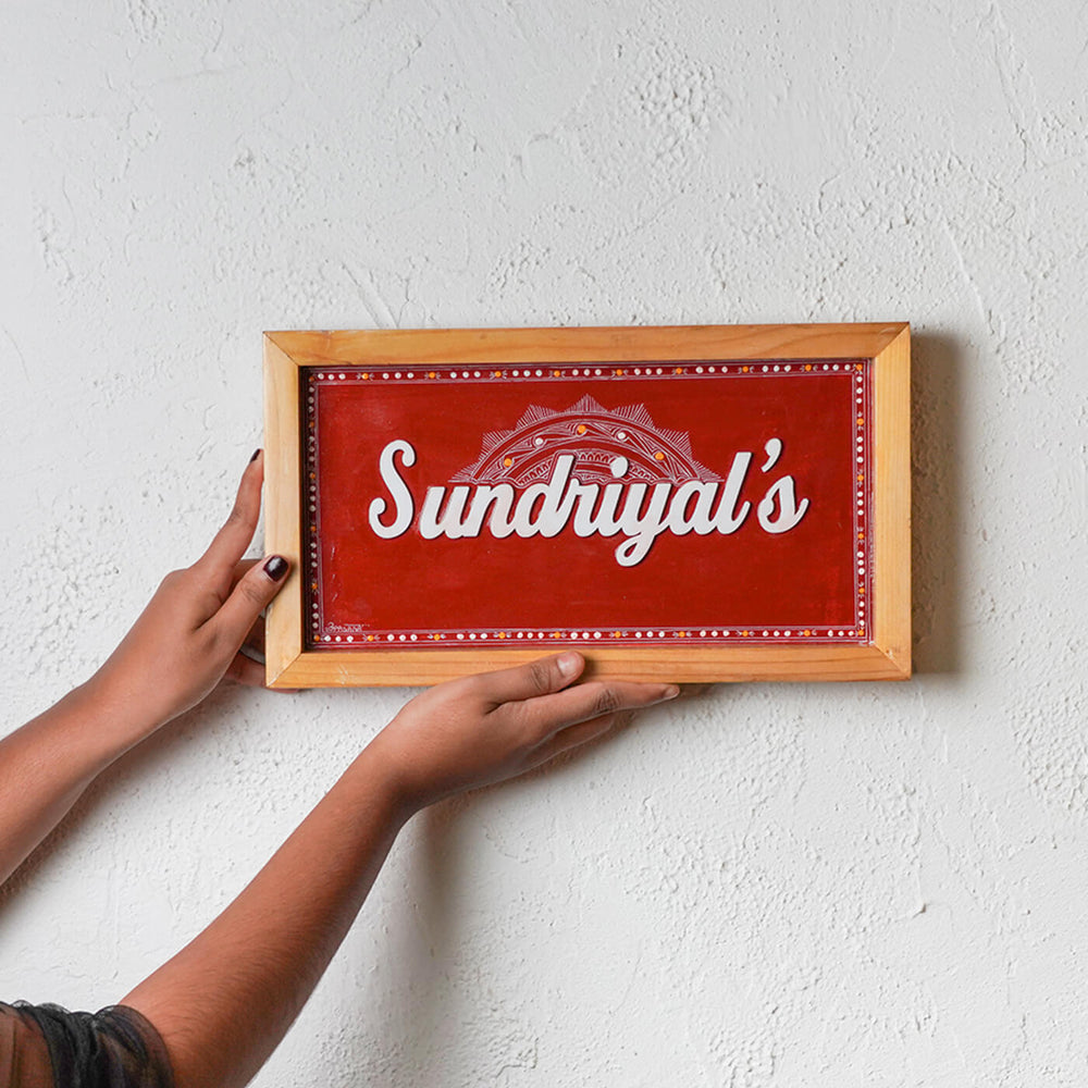 Handcrafted Personalized Aipan Art Name Plate With Wooden Frame - Name Personalization Example Held on Wall
