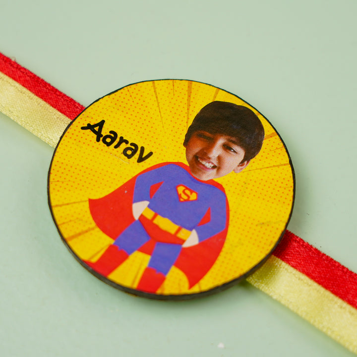 Photo Personalized Handmade Reusable Caricature Superman Mdf Wood Kids Rakhi With Roli Chawal - Close-up of personalized badge
