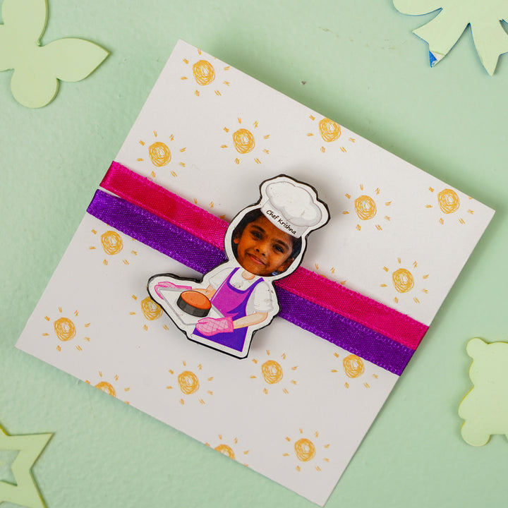 Photo Personalized Handmade Reusable Caricature Girl Chef Mdf Wood Kids Rakhi With Roli Chawal - Flat Lay Presenter Card with Charm