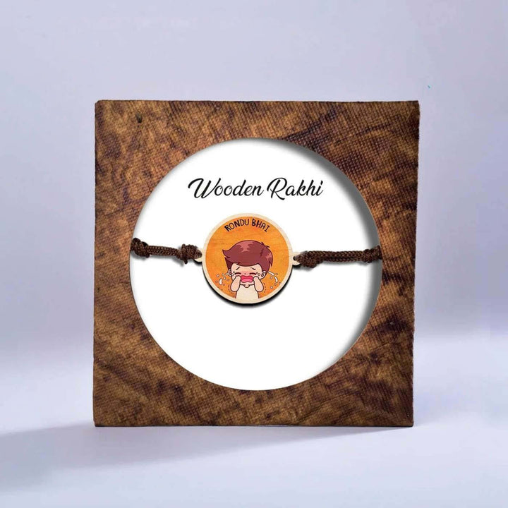Handmade Rondu Bhai Wooden Rakhi With Roli Chawal - Packaged Rakhi on white background