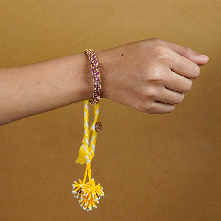 Reusable Beaded Yellow Flower Lumba Rakhi For Bhabhi With Roli Chawal - Worn on wrist showcase