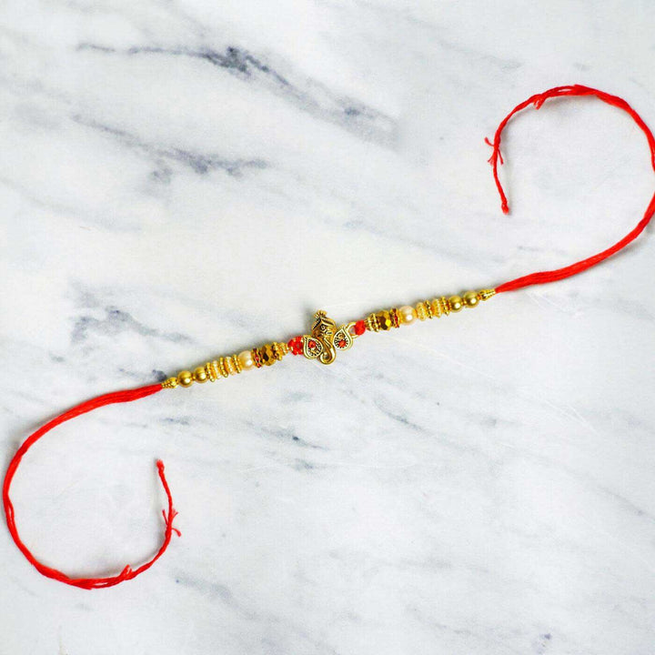 Personalized Embroidered Dark Grey Cotton Towel Rakhi Hamper With Roli Chawal For Brother Includes 1 Hand Towel 1 Bath Towel And 1 Rakhi - Full Rakhi Display on Surface