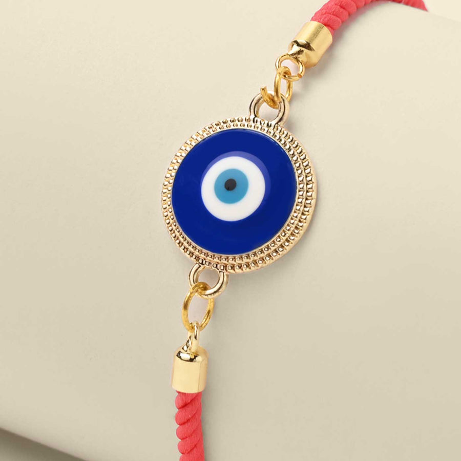 Handmade Bold Evil Eye Design Metal Rakhi - Close-up of charm detail