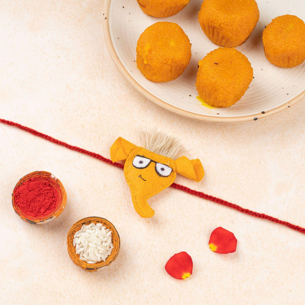 Handcrafted Kids Rakhi With Roli Chawal Set Of 2 - Styled Product with Elephant Rakhi