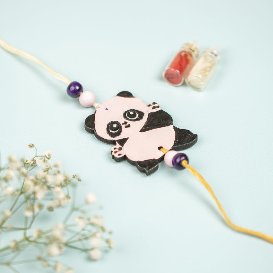 Hand Painted Panda Design Mdf Wood Kids Rakhi - Close-up of Panda Charm with Beads