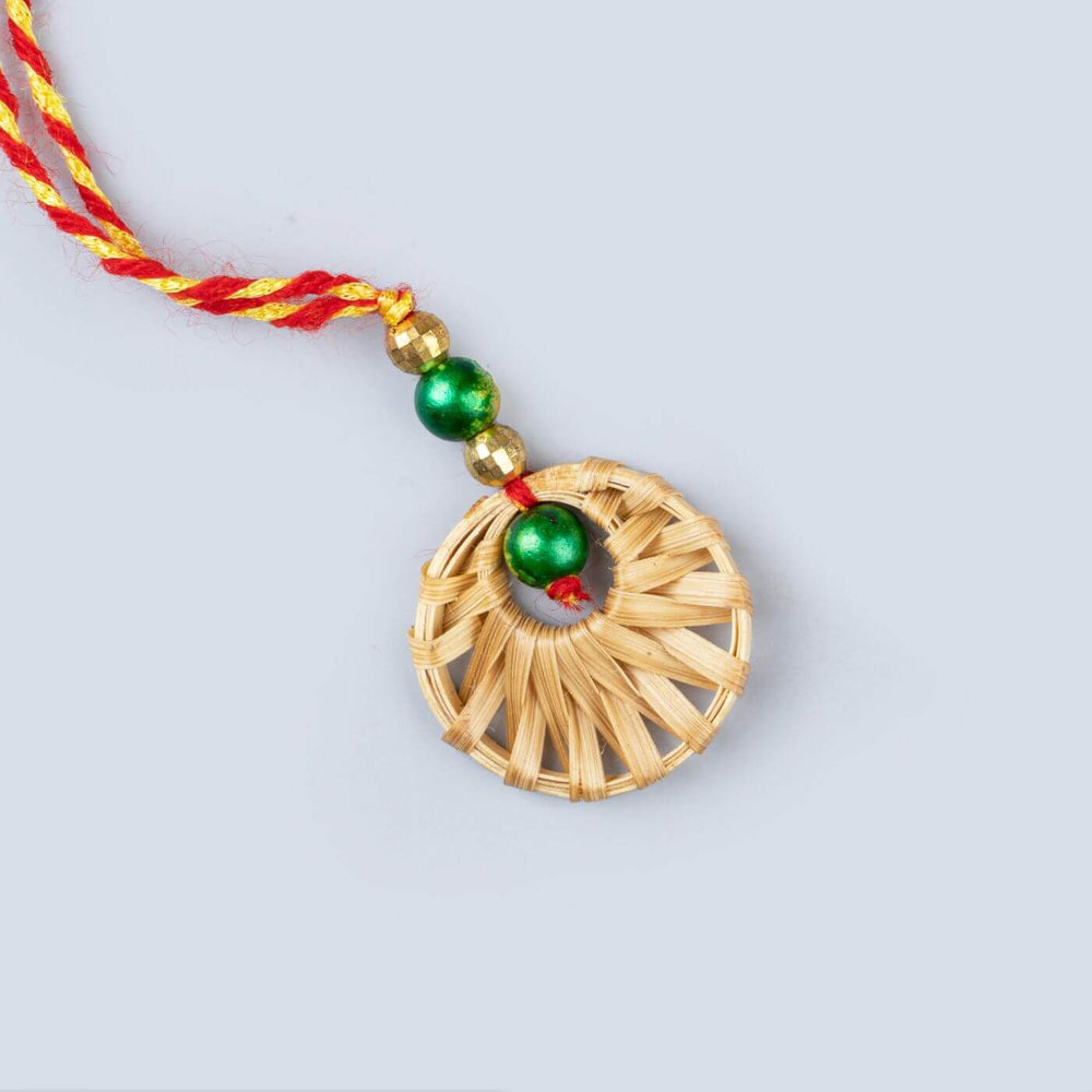 Ecofriendly Bamboo Rakhis For Bhaiya Bhabhi With Roli Chawal 3 - Close-up of circular pendant detail