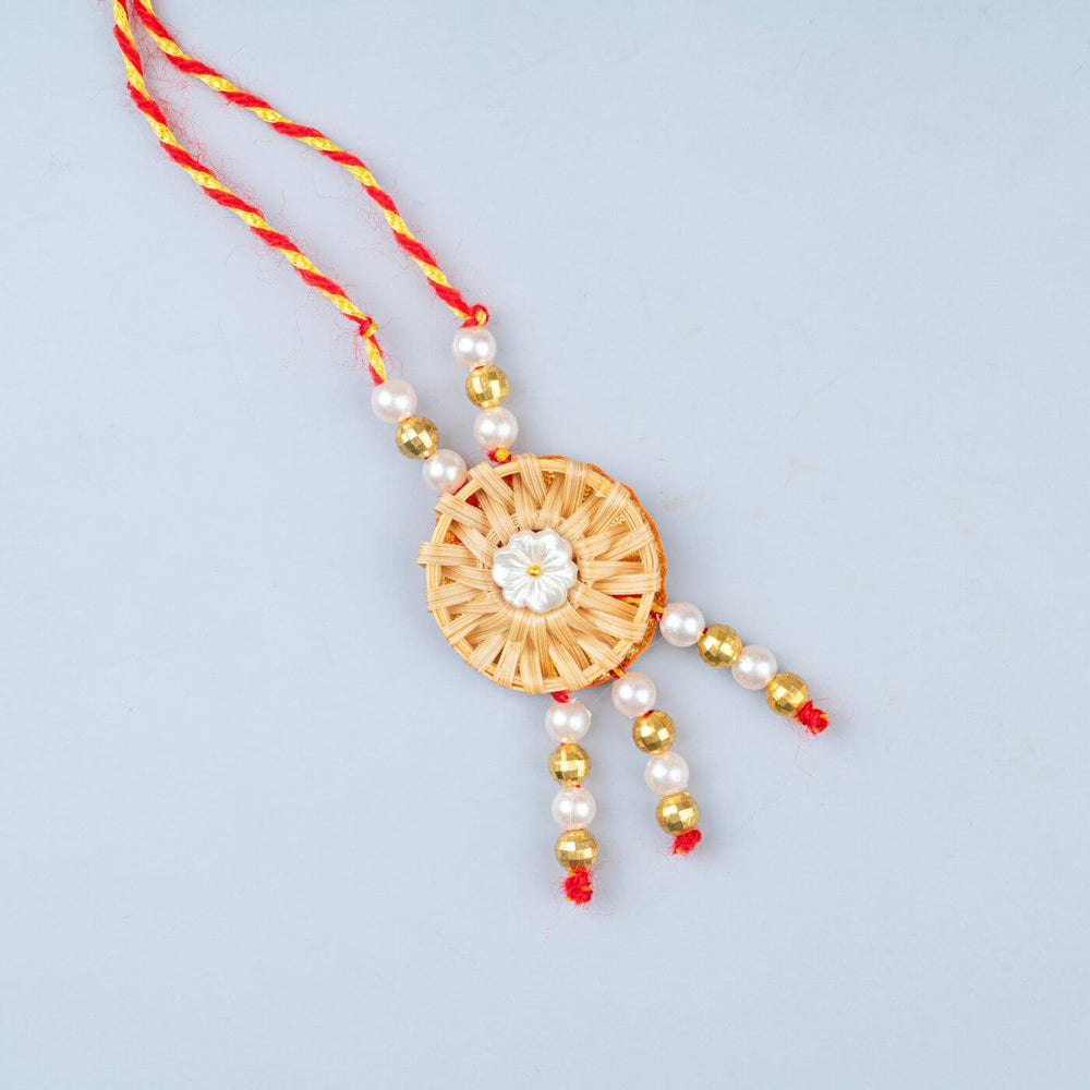 Ecofriendly Bamboo Rakhis For Bhaiya Bhabhi With Roli Chawal 6 - Close-up of rakhi design
