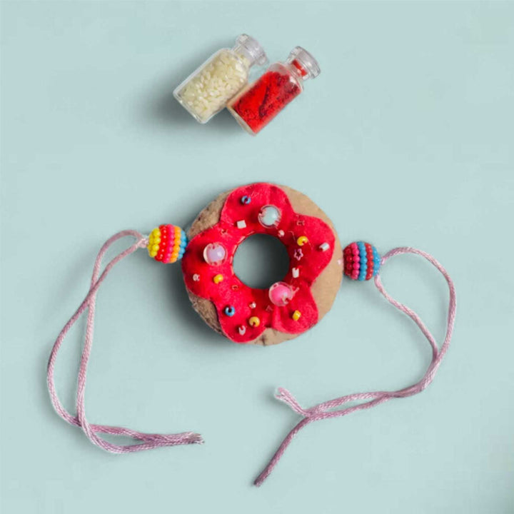 Handmade Doughnut Theme Felt Rakhi With Roli Chawal - Flat Lay with Roli Chawal