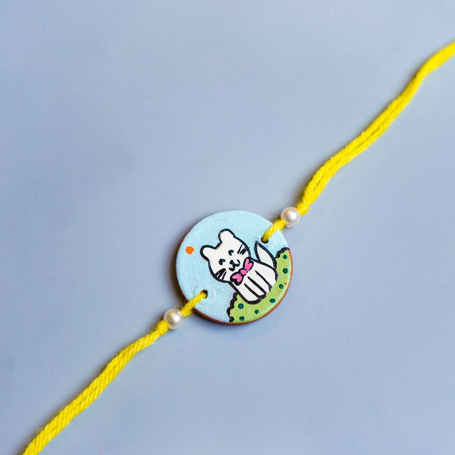 Personalized Animal Theme Terracotta Rakhi With Roli Chawal For Kids 2 - Close-up of Cat Charm