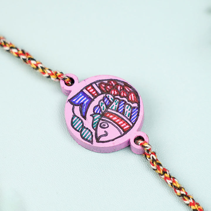 Hand Painted Madhubani Fish Design Beads Wooden Rakhi With Roli Chawal For Brother - Close-up of Pendant Detail