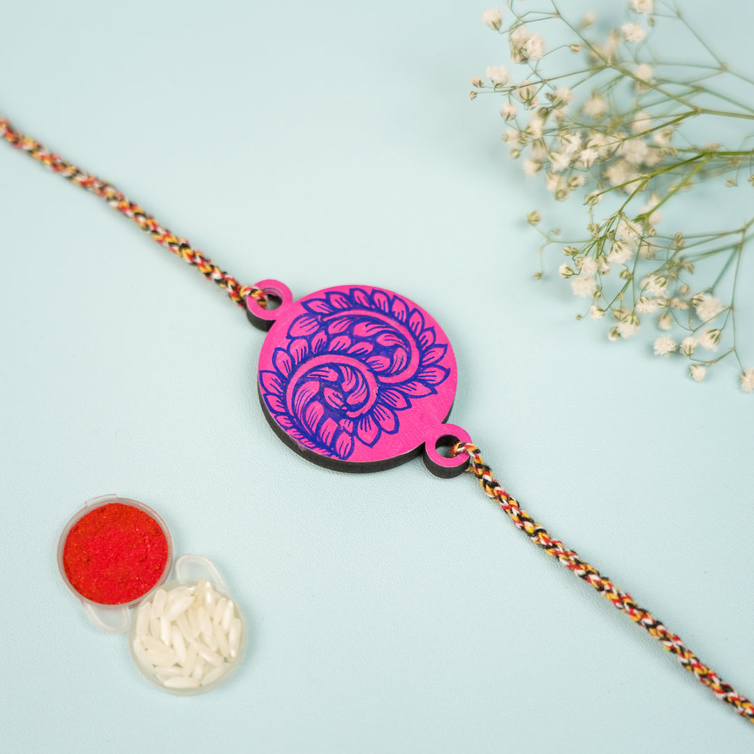 Hand Painted Pattachitra Leaf Design Wooden Rakhi With Roli Chawal For Brother - Flat Lay with Powder and Rice