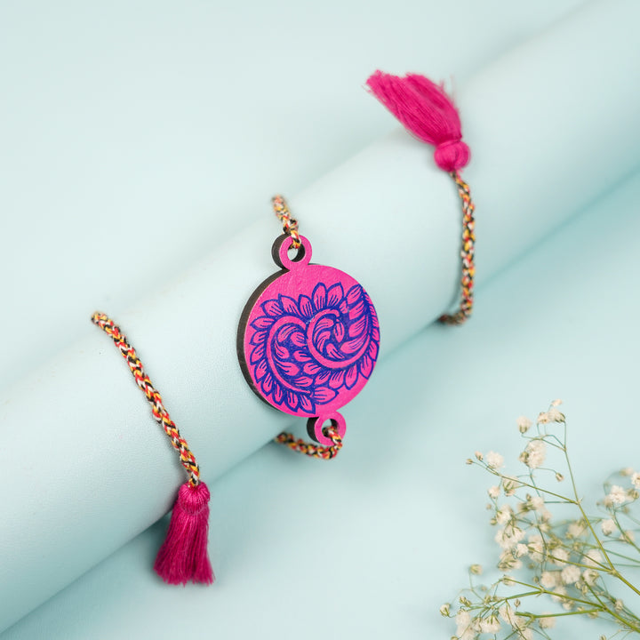 Hand Painted Pattachitra Leaf Design Wooden Rakhi With Roli Chawal For Brother - Wrapped Around Cylindrical Object