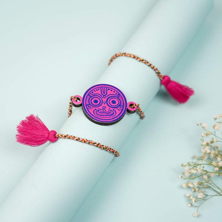 Hand Painted Pattachitra Bhava Nethra Wooden Rakhi With Roli Chawal For Brother - Styled on Rolled Paper Display