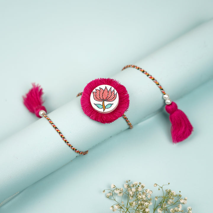 Hand Painted Madhubani Red Lotus Design Wooden Rakhi With Roli Chawal For Brother - Wrapped on Cylinder Display