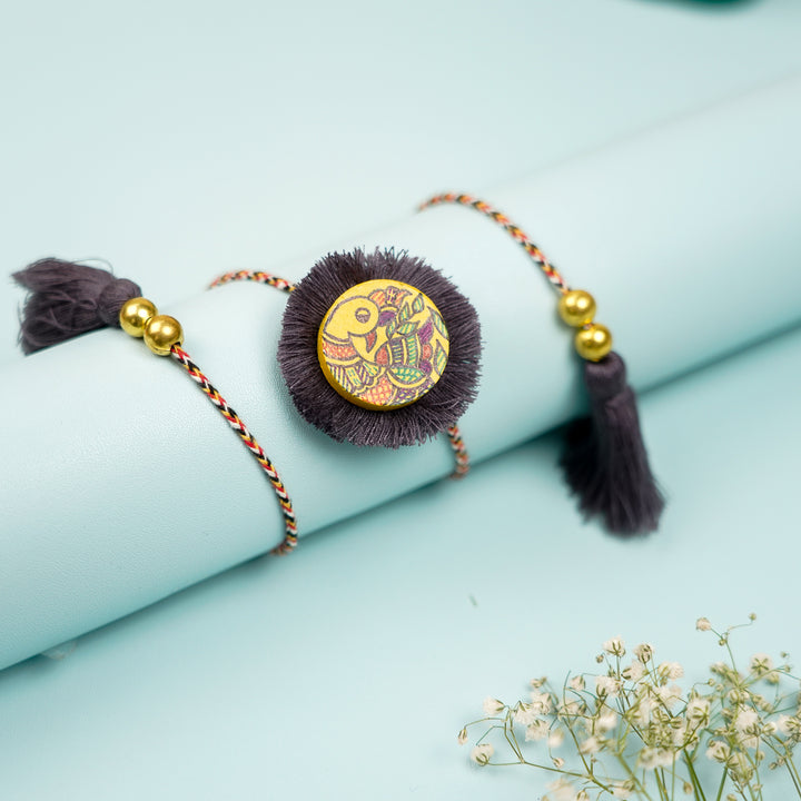 Hand Painted Madhubani Peacock Design Wooden Rakhi With Roli Chawal For Brother - Styled on Rolled Surface