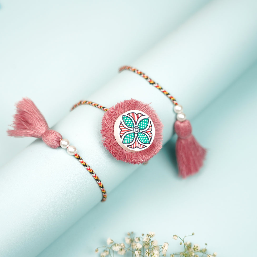 Hand Painted Madhubani Pink Flower Design Wooden Rakhi With Roli Chawal For Brother - Wrapped on Roll Display